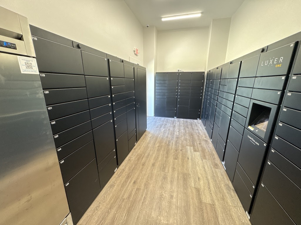 Luxer One® smart package room with indoor locker banks and refrigerated storage