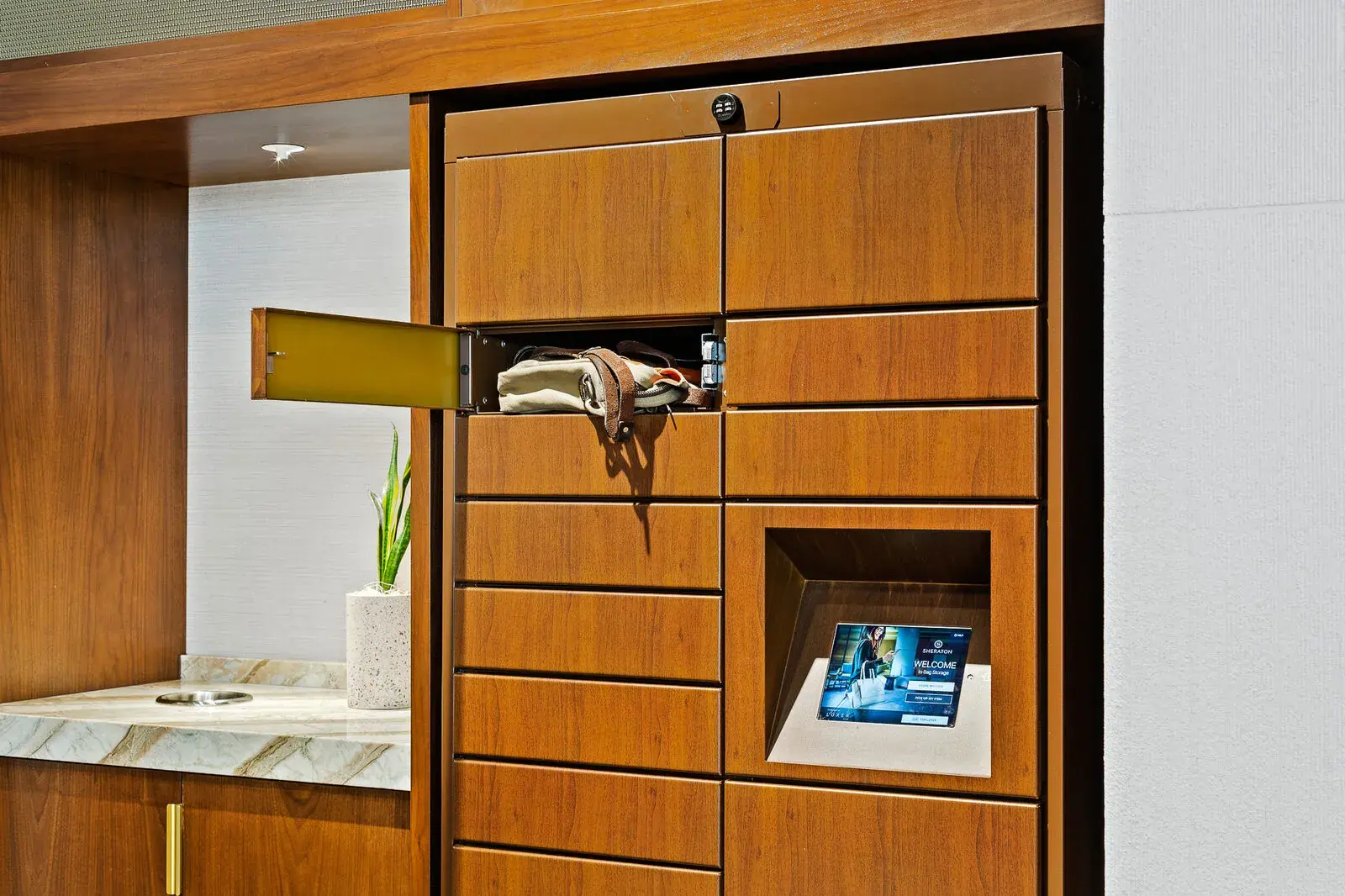 Luxer One package lockers installed in an apartment community lobby